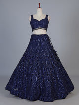 Blue net lehenga choli with intricate pearl cutdana embellishments