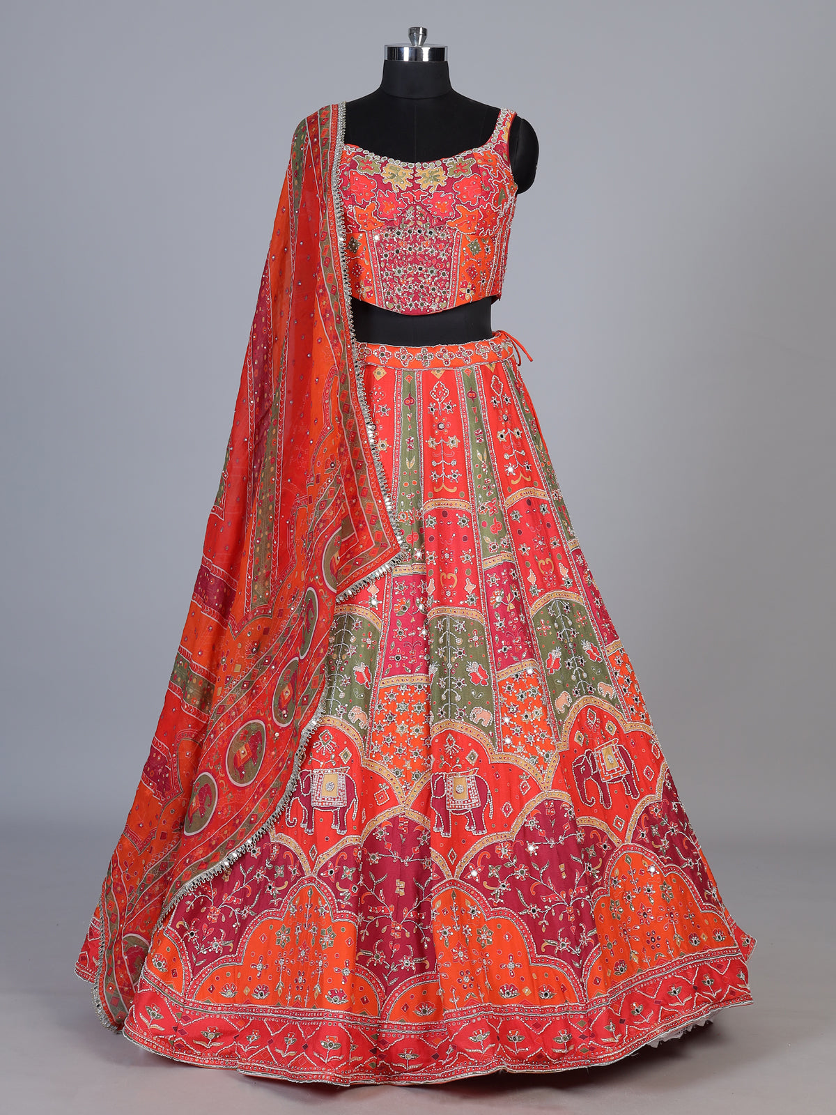 Orange art silk lehenga choli with elephant motif embellishments