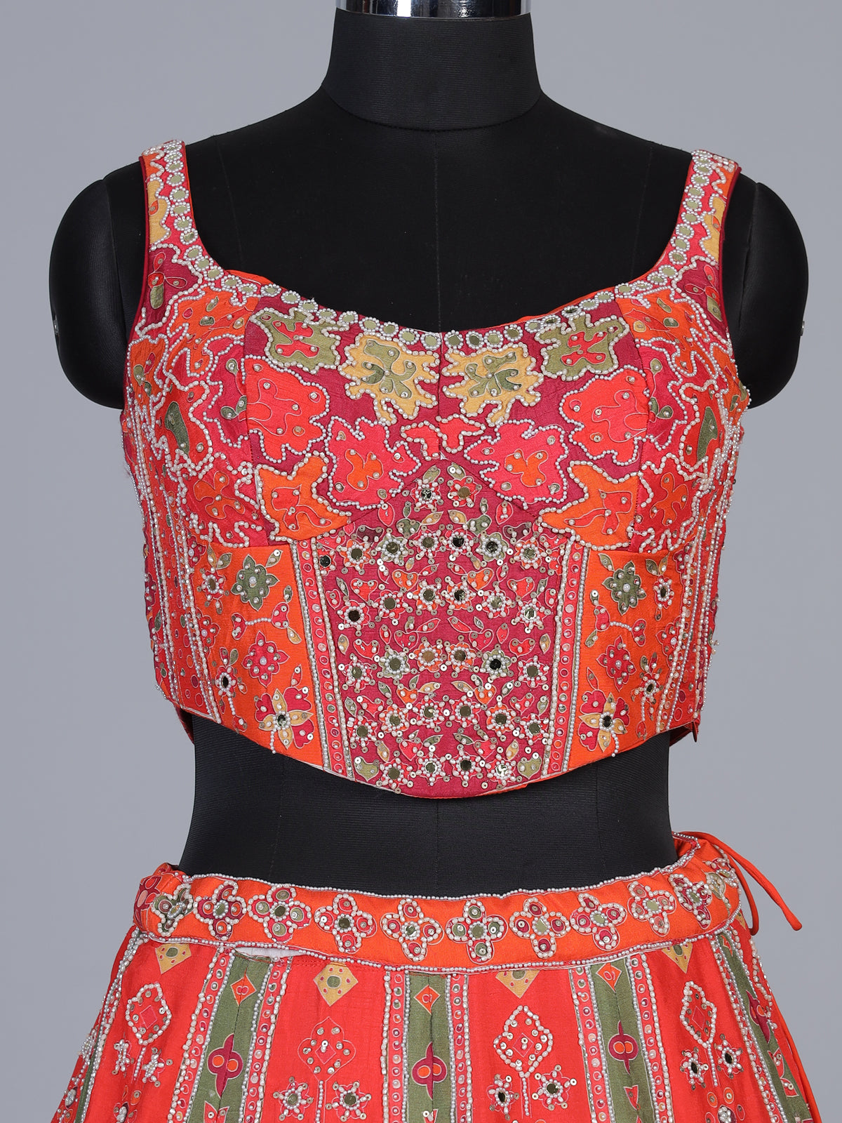 Orange art silk lehenga choli with elephant motif embellishments