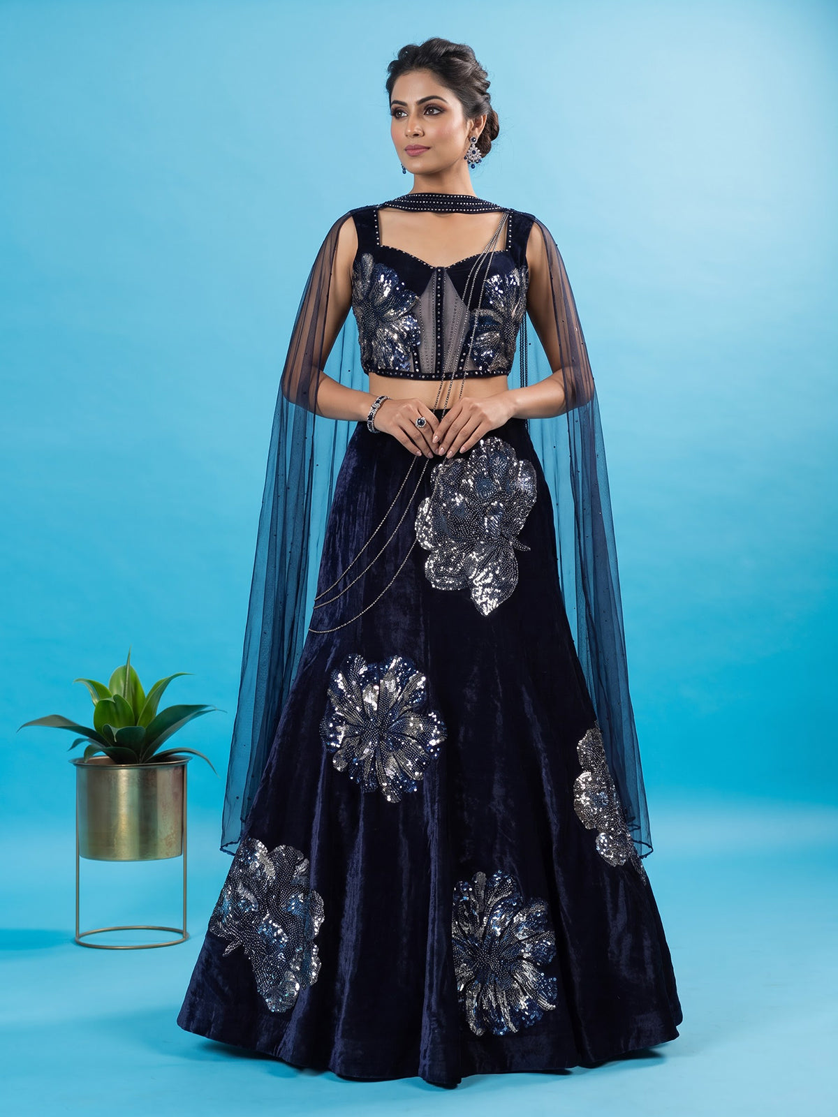 Blue velvet lehenga choli with cutdana and pearl embellishments