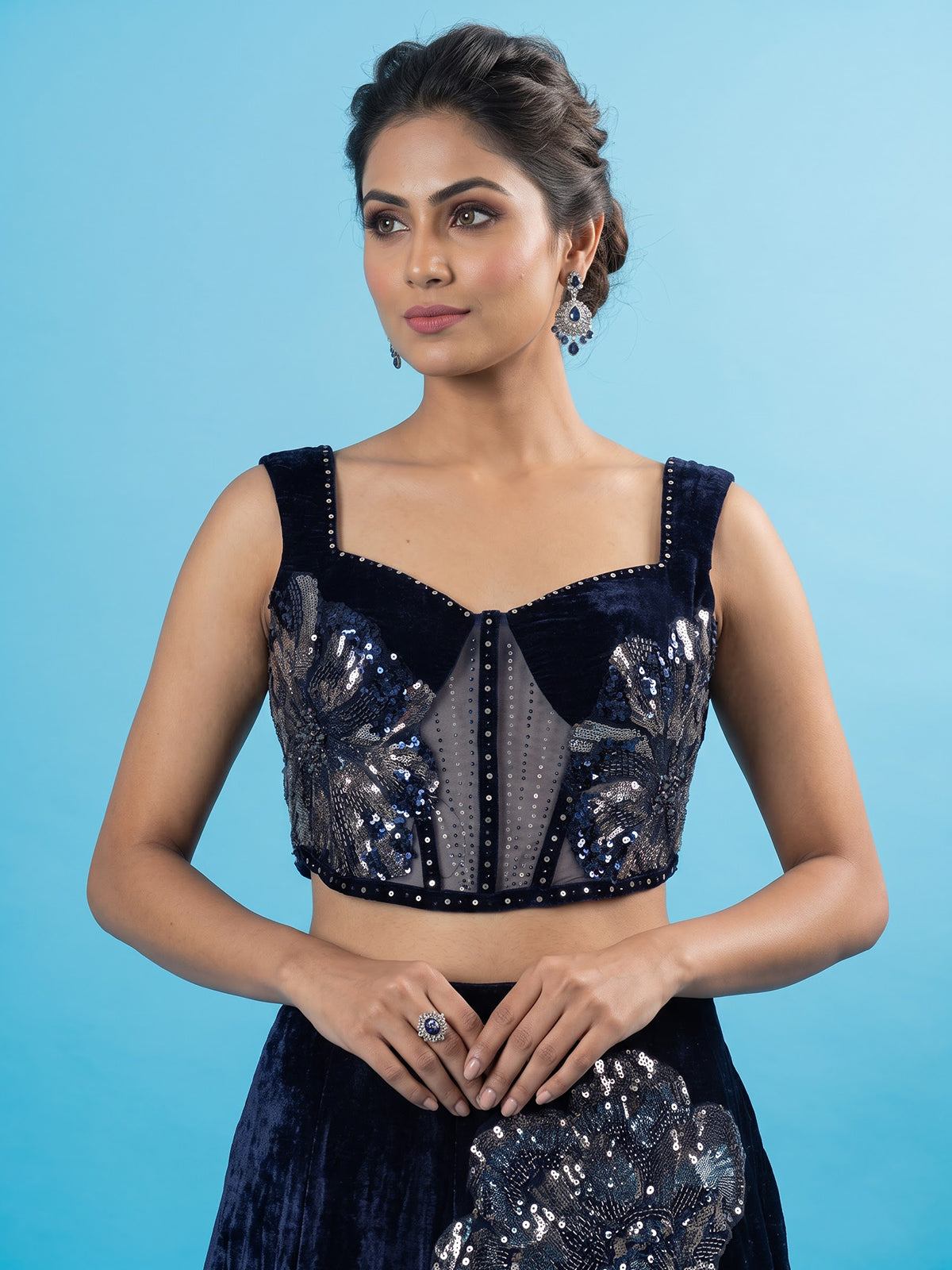 Blue velvet lehenga choli with cutdana and pearl embellishments