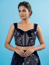 Blue velvet lehenga choli with cutdana and pearl embellishments