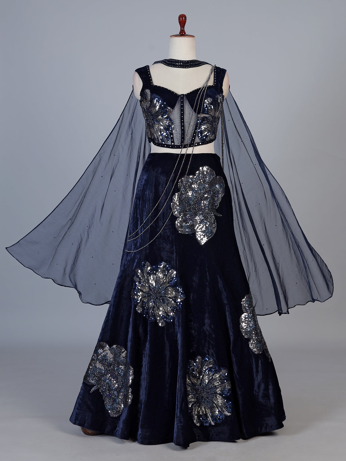 Blue velvet lehenga choli with cutdana and pearl embellishments