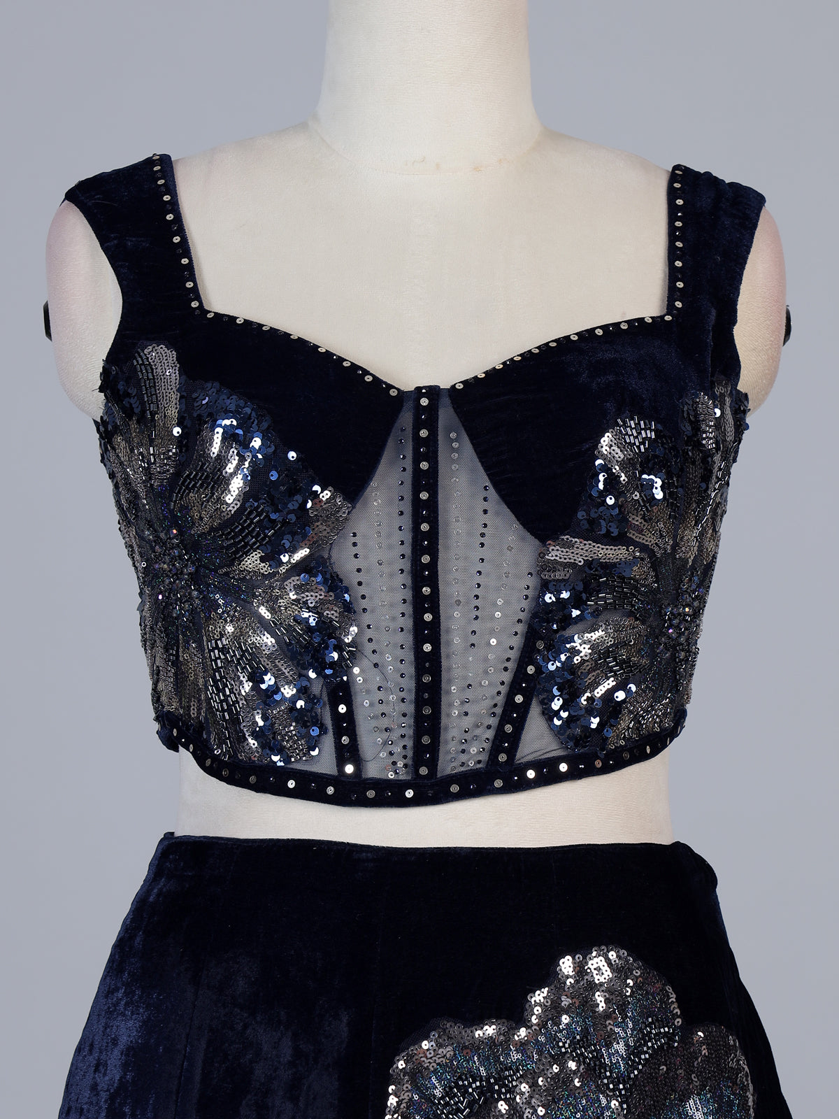 Blue velvet lehenga choli with cutdana and pearl embellishments