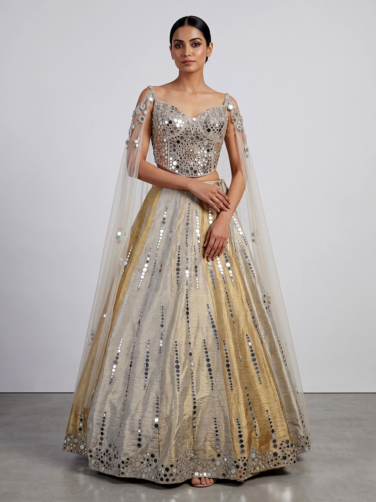 Golden tissue blend lehenga choli with mirror cutdana embellishments