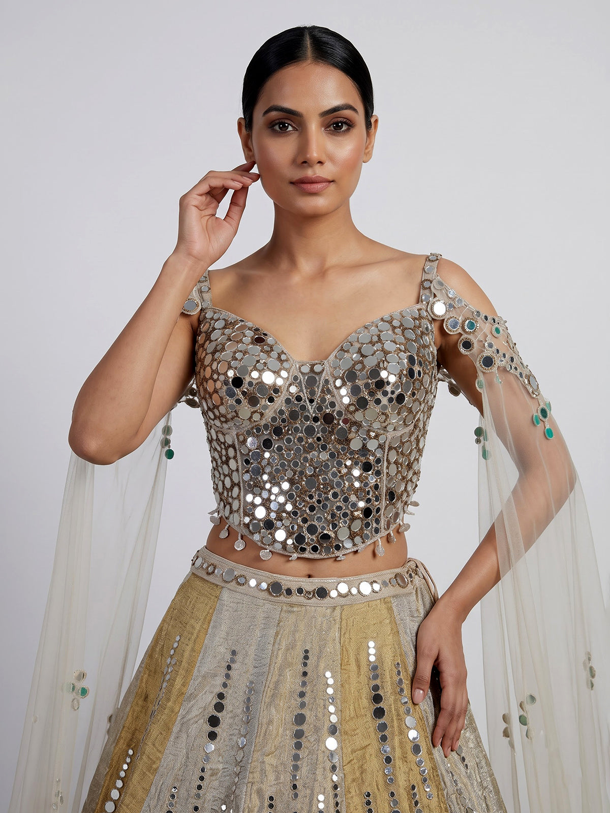 Golden tissue blend lehenga choli with mirror cutdana embellishments
