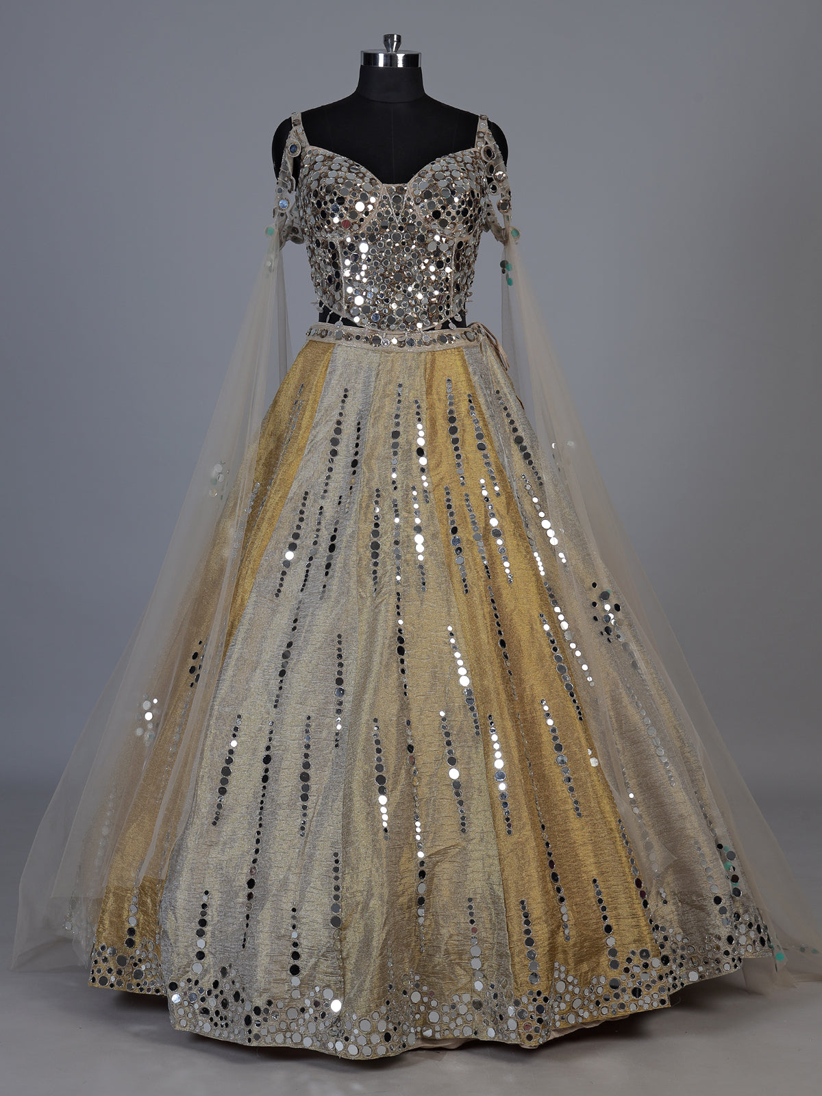 Golden tissue blend lehenga choli with mirror cutdana embellishments