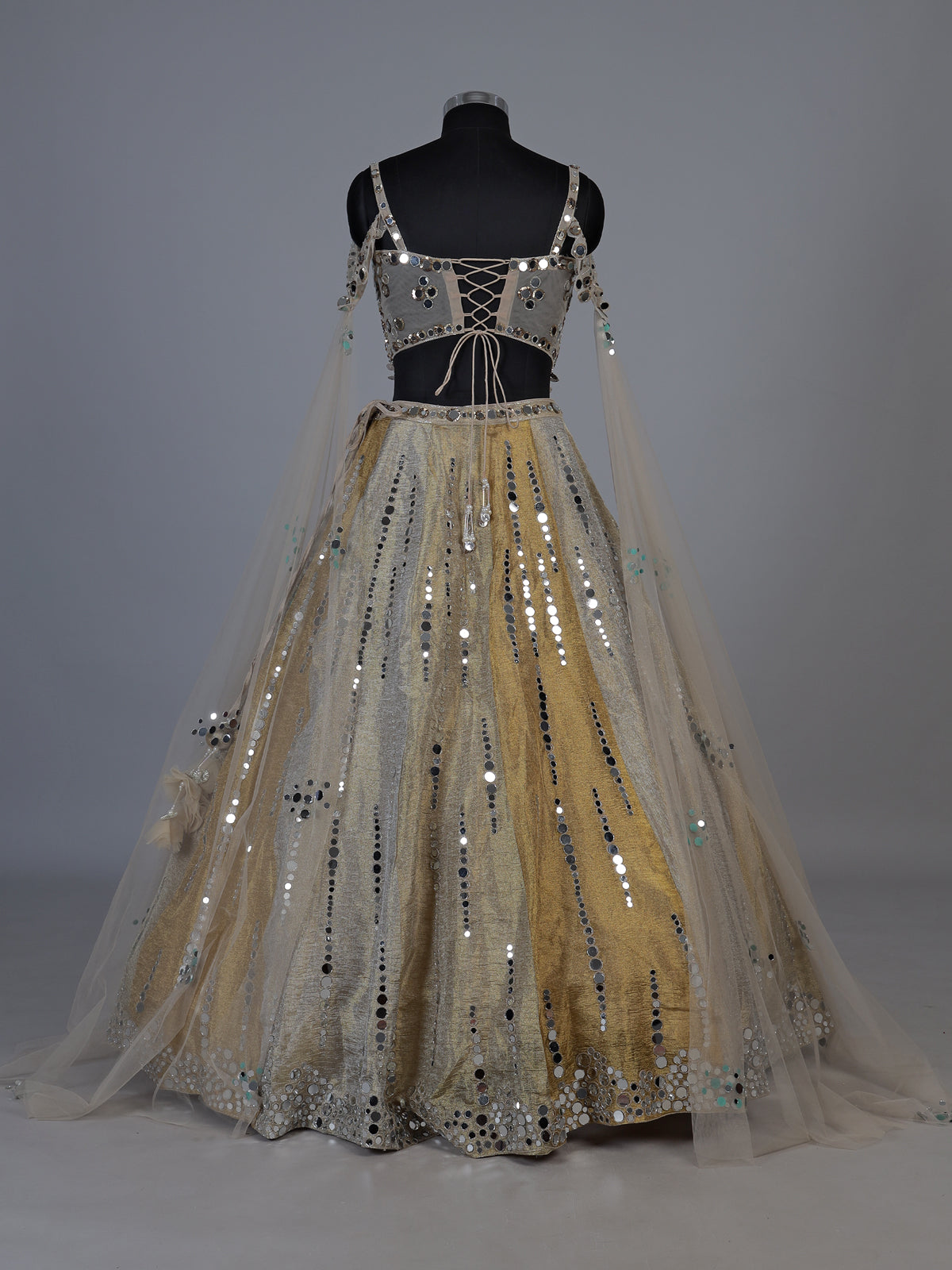 Golden tissue blend lehenga choli with mirror cutdana embellishments
