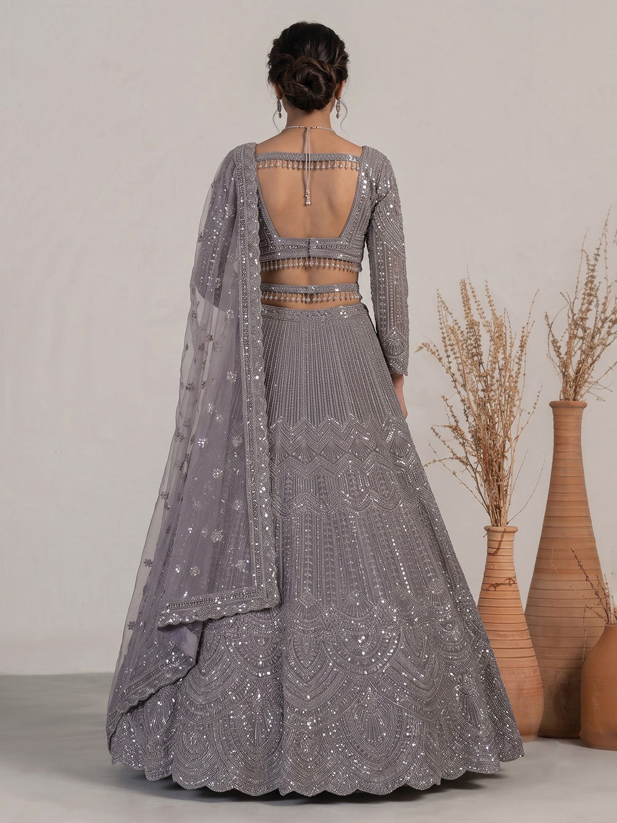 Lavender purple net lehenga choli with sparkling diamond tassel detailing