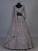 Lavender purple net lehenga choli with sparkling diamond tassel detailing