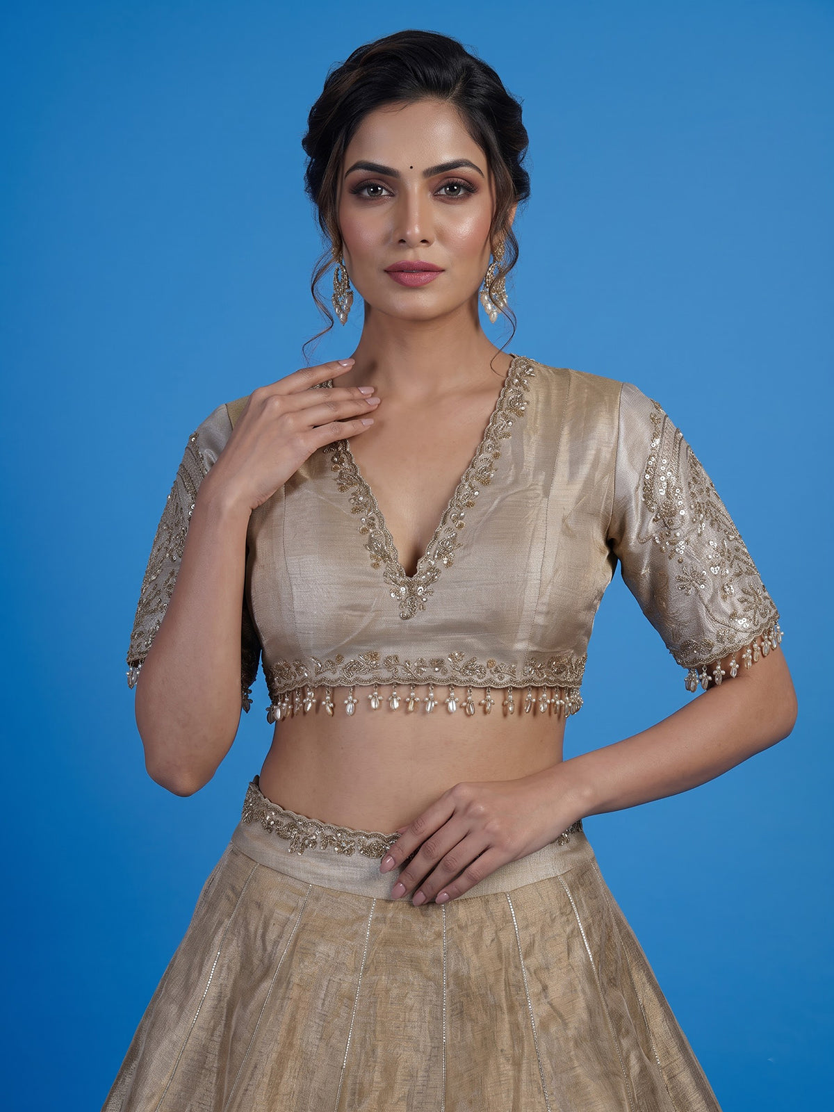 Golden silk lehenga choli with zardosi gota and zari embellishments