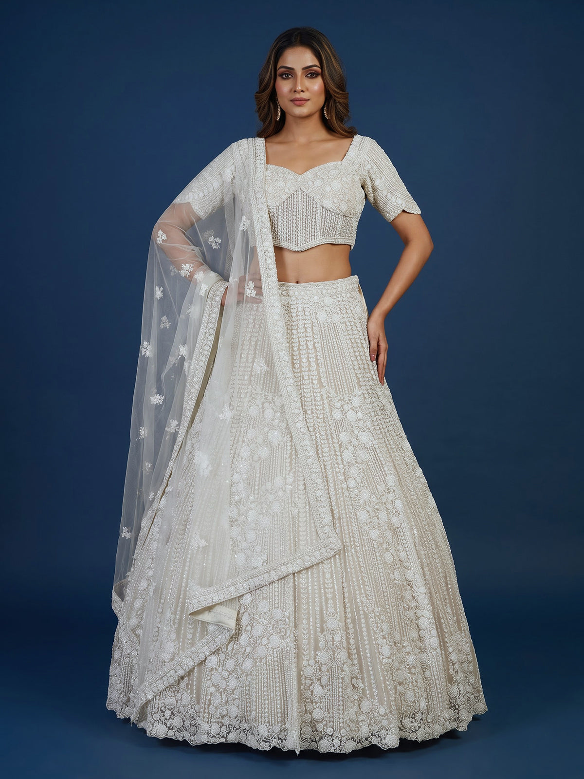 White net lehenga choli with delicate cutdana sequins detailing