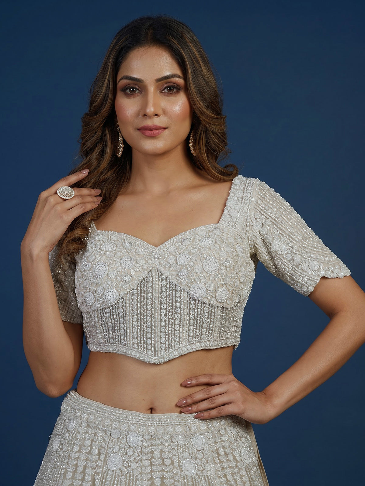 White net lehenga choli with delicate cutdana sequins detailing