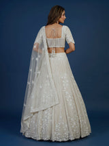 White net lehenga choli with delicate cutdana sequins detailing