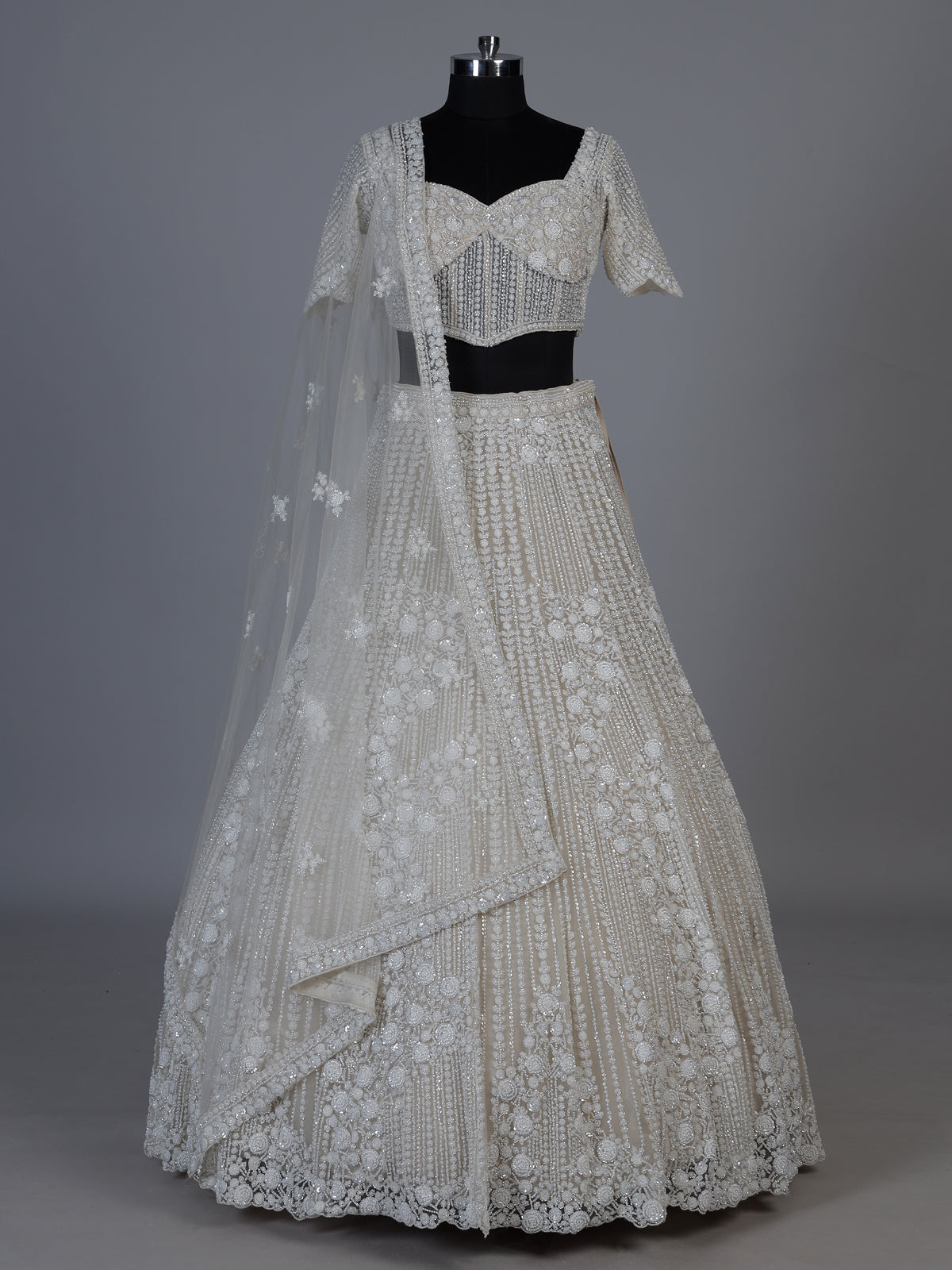 White net lehenga choli with delicate cutdana sequins detailing