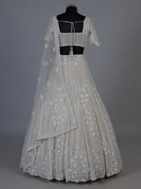 White net lehenga choli with delicate cutdana sequins detailing