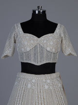 White net lehenga choli with delicate cutdana sequins detailing