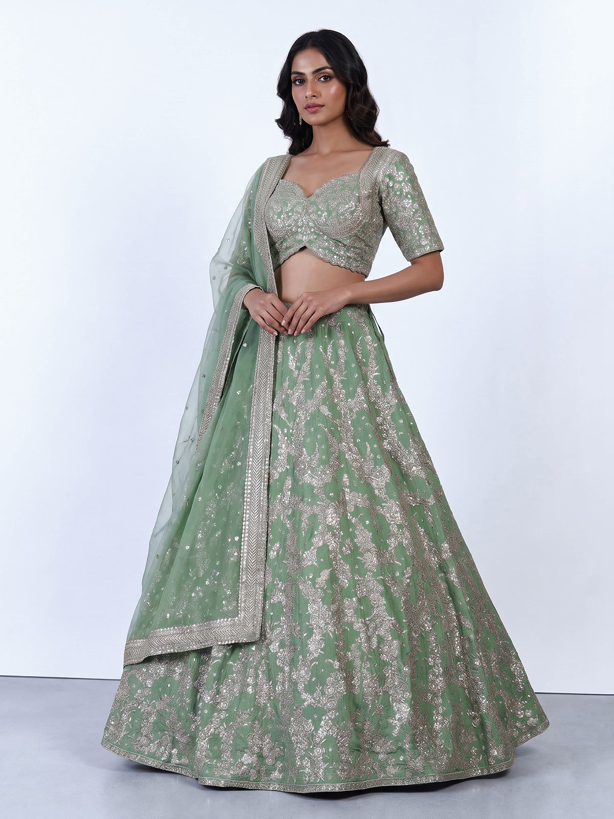 Pista green silk lehenga choli with resham floral embellishments