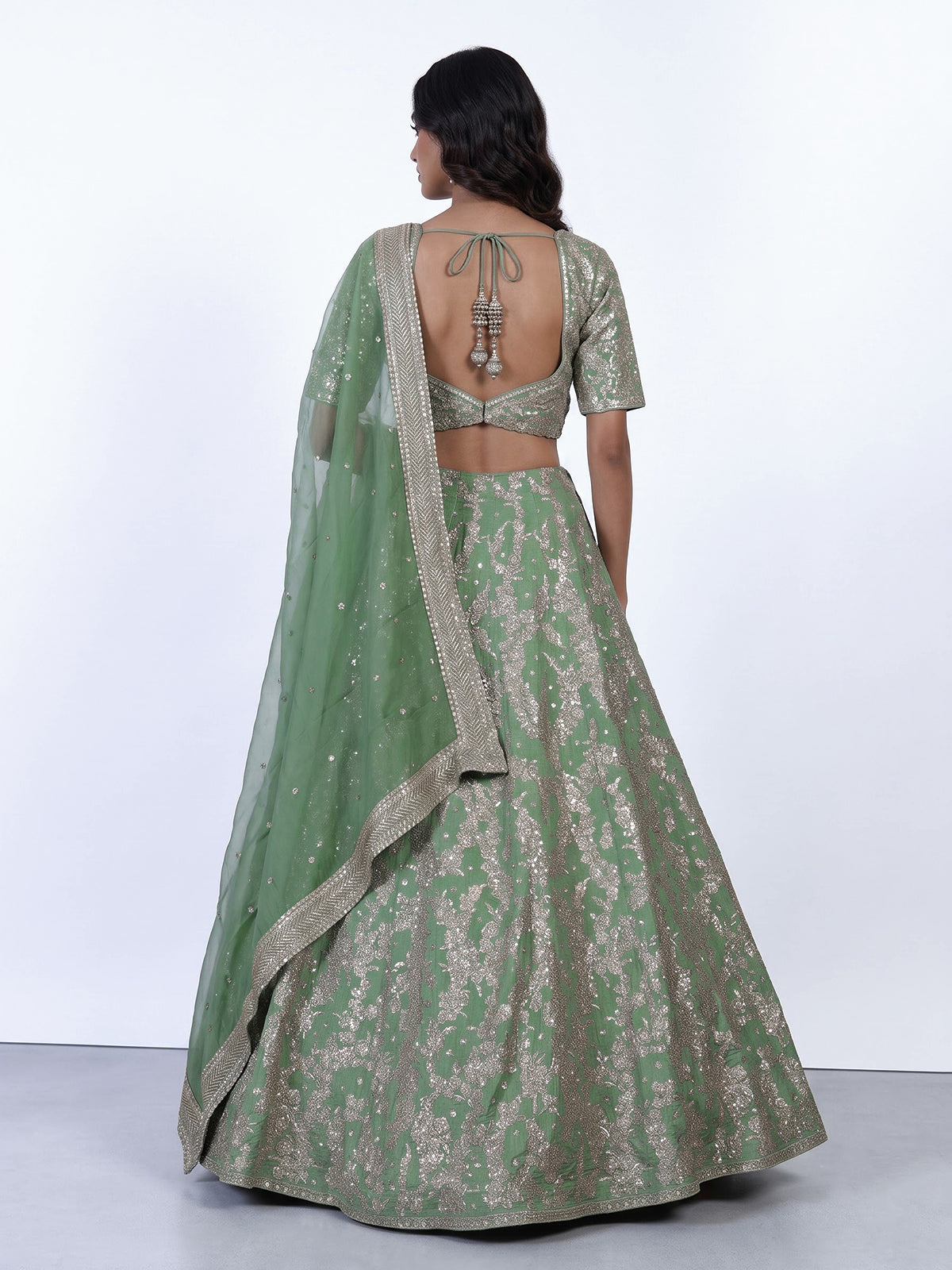 Pista green silk lehenga choli with resham floral embellishments