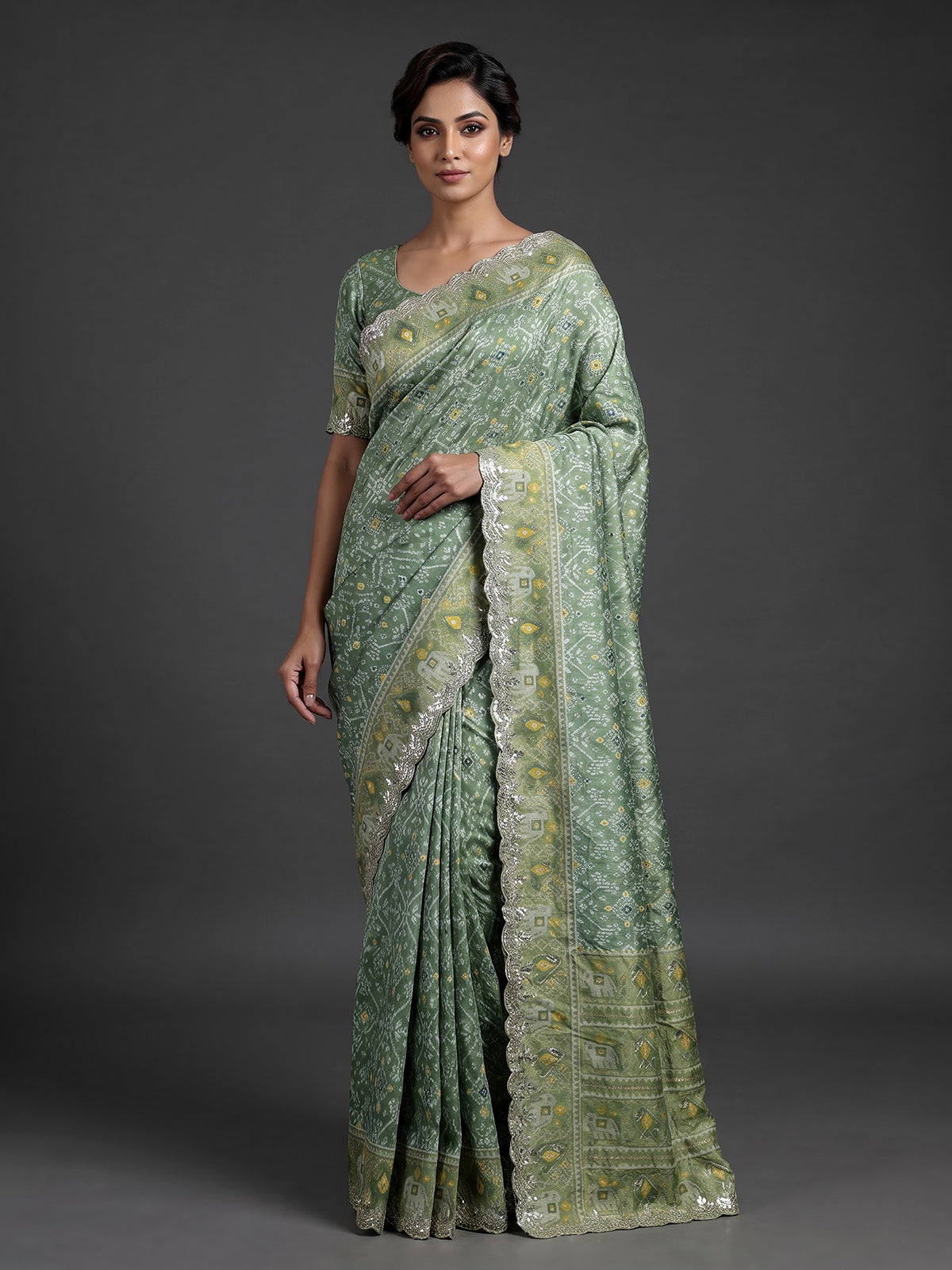 Pista green soft silk saree with charming patola printed artistry