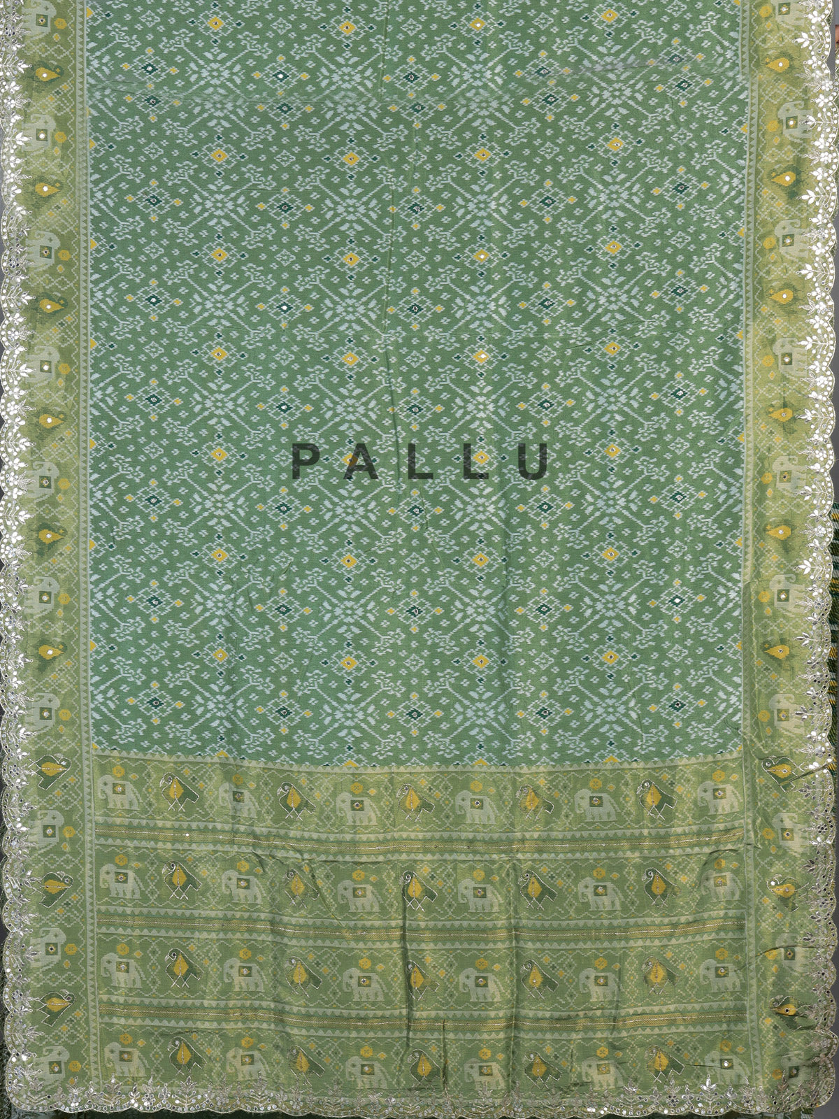 Pista green soft silk saree with charming patola printed artistry