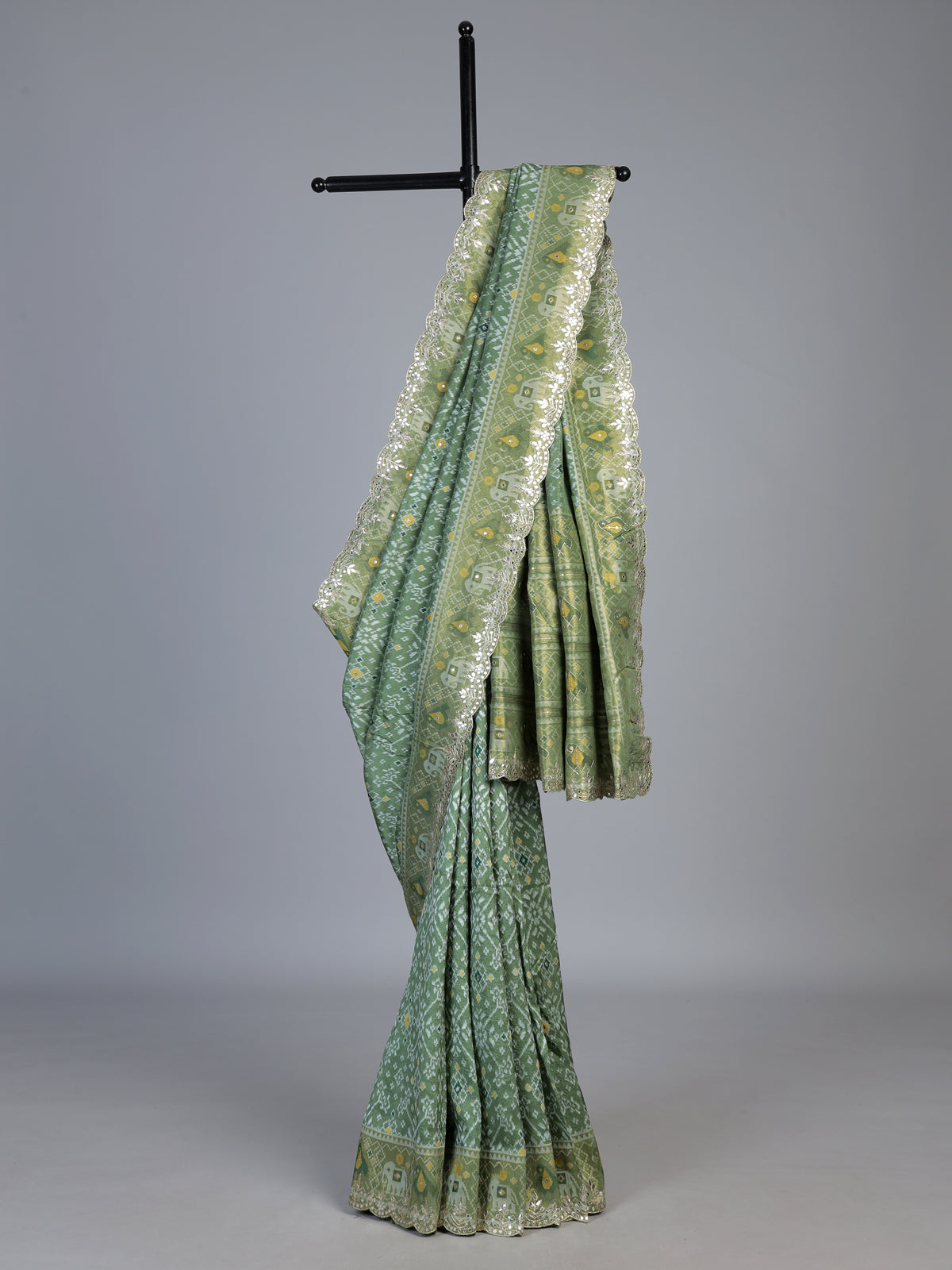 Pista green soft silk saree with charming patola printed artistry
