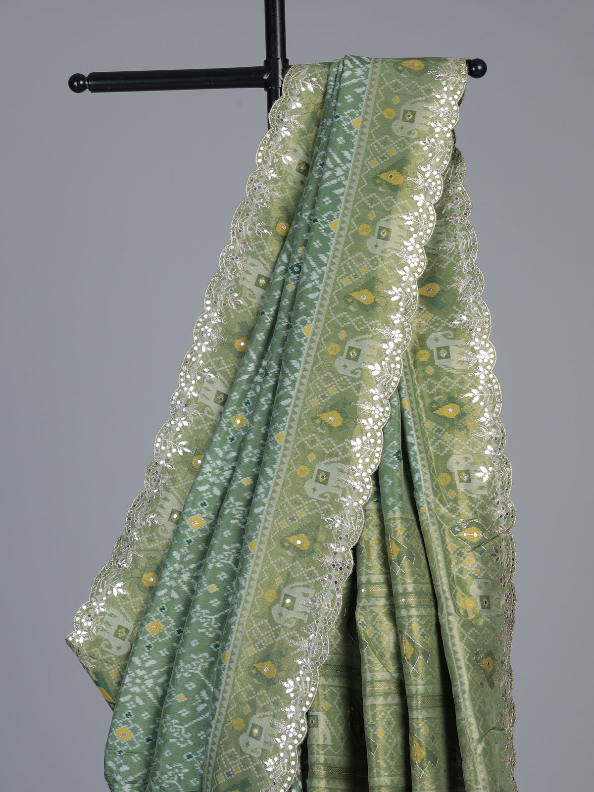 Pista green soft silk saree with charming patola printed artistry