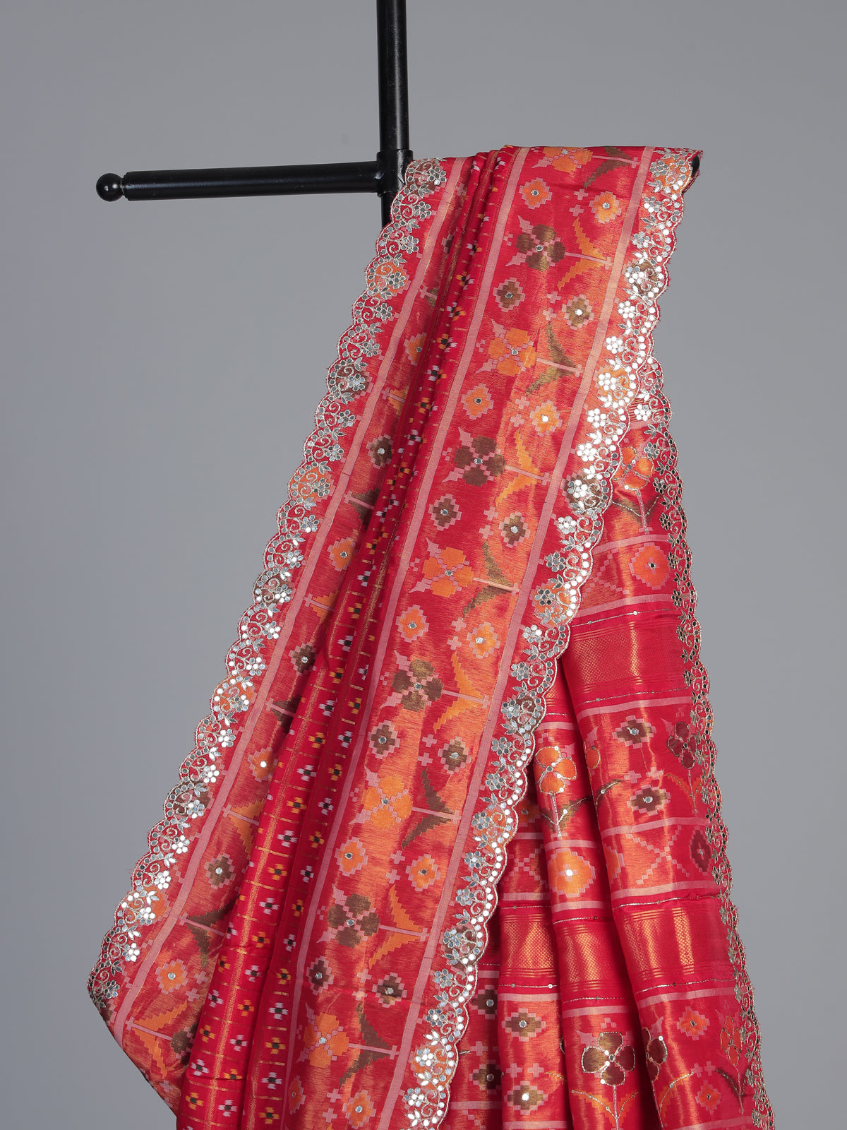 Red soft silk saree with traditional ikat printed zari elegance
