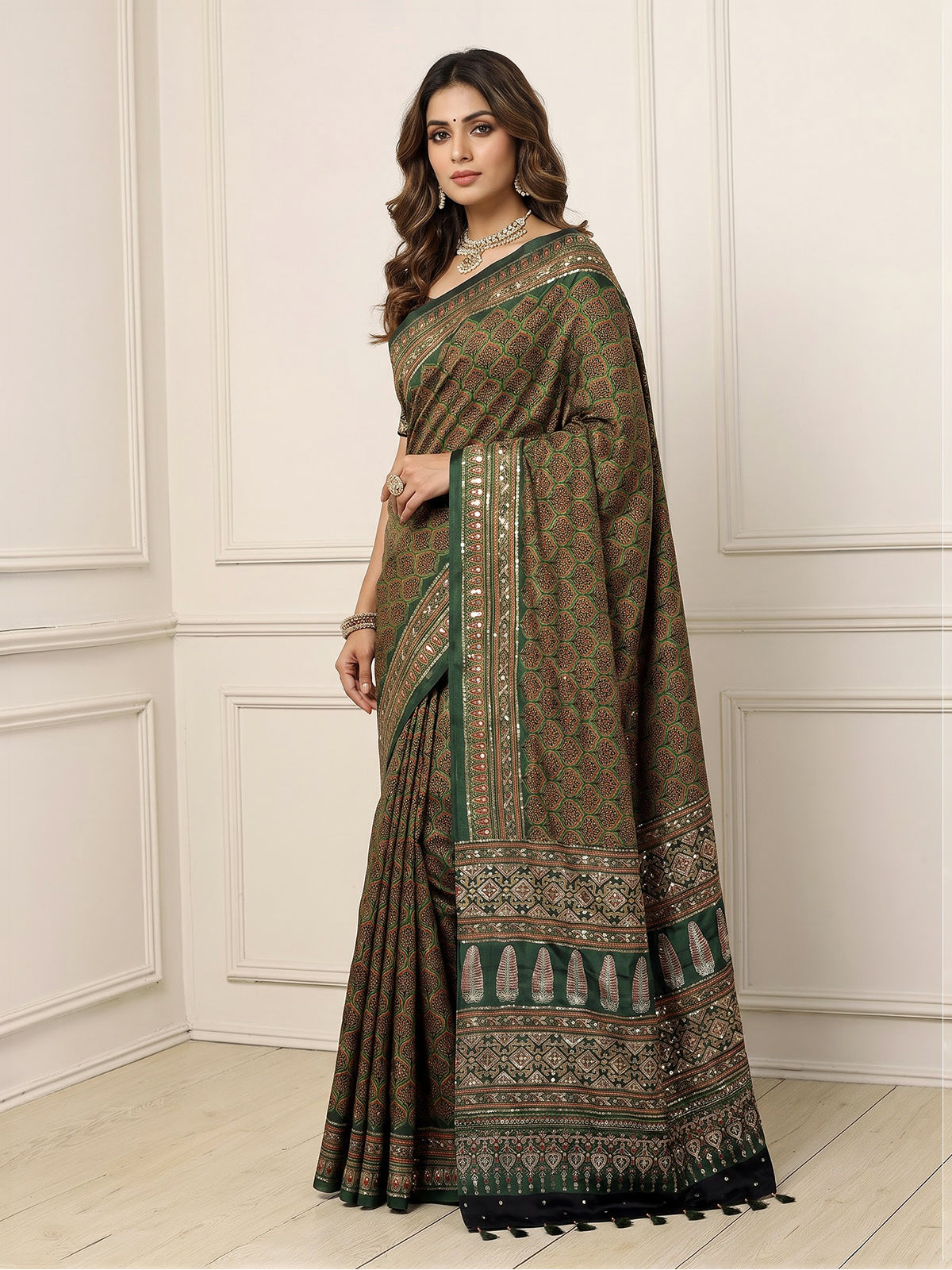 Green crepe silk saree with graceful printed festive detailing