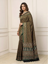 Green crepe silk saree with graceful printed festive detailing