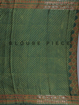 Green crepe silk saree with graceful printed festive detailing