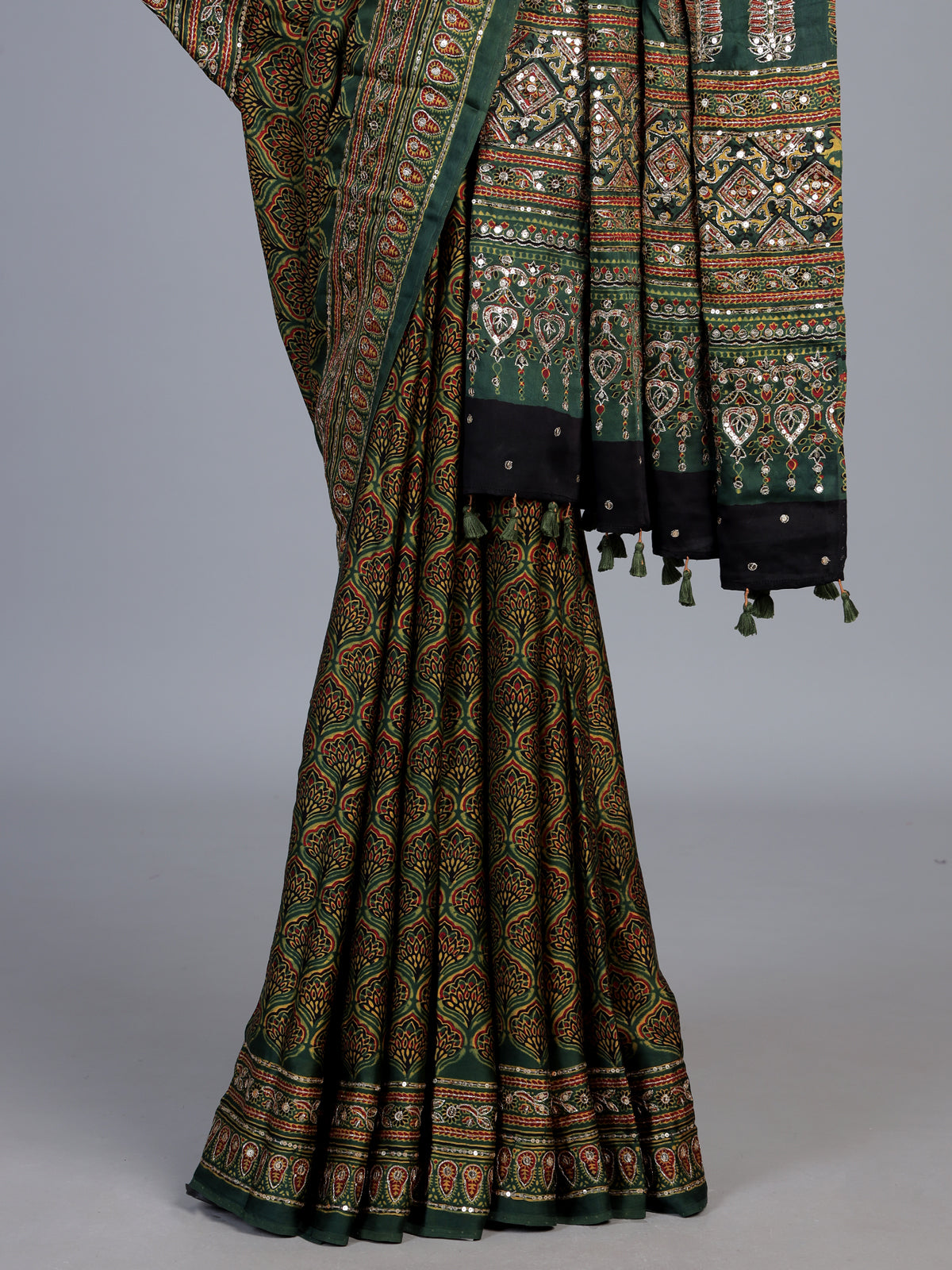 Green crepe silk saree with graceful printed festive detailing