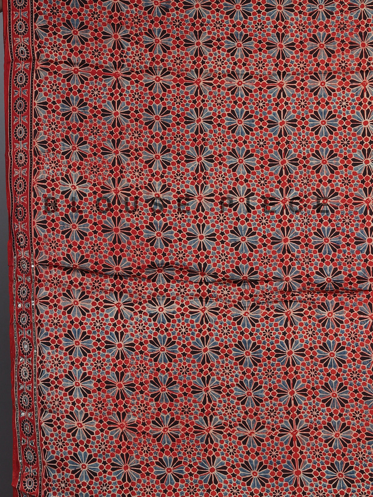 Red crepe silk saree with shimmering mirror printed accents