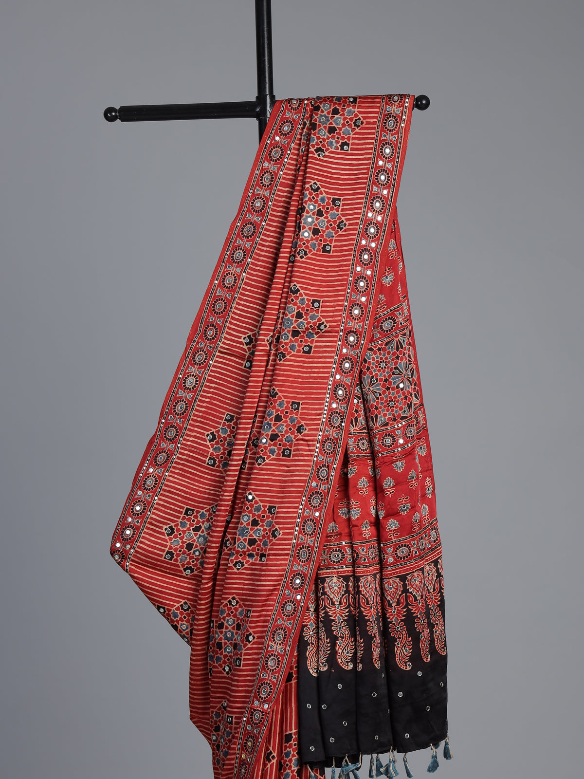 Red crepe silk saree with shimmering mirror printed accents