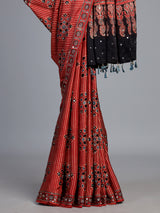 Red crepe silk saree with shimmering mirror printed accents