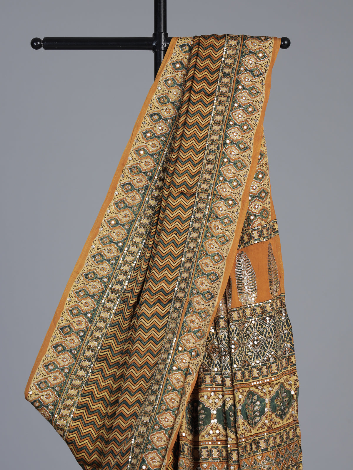 Mustard yellow crepe silk saree with zigzag printed elegance