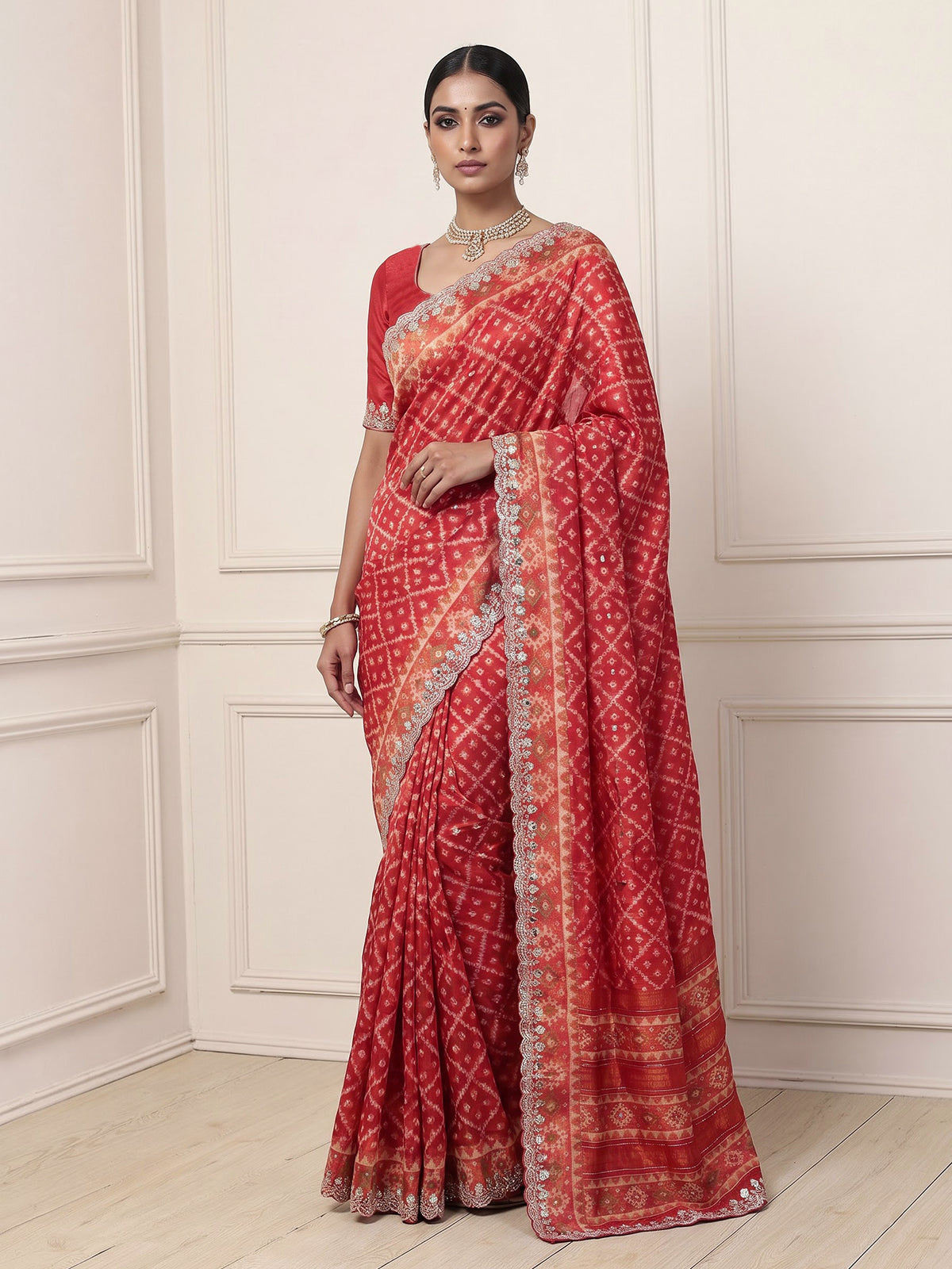 Rust orange soft silk saree with graceful ikat printed detailing