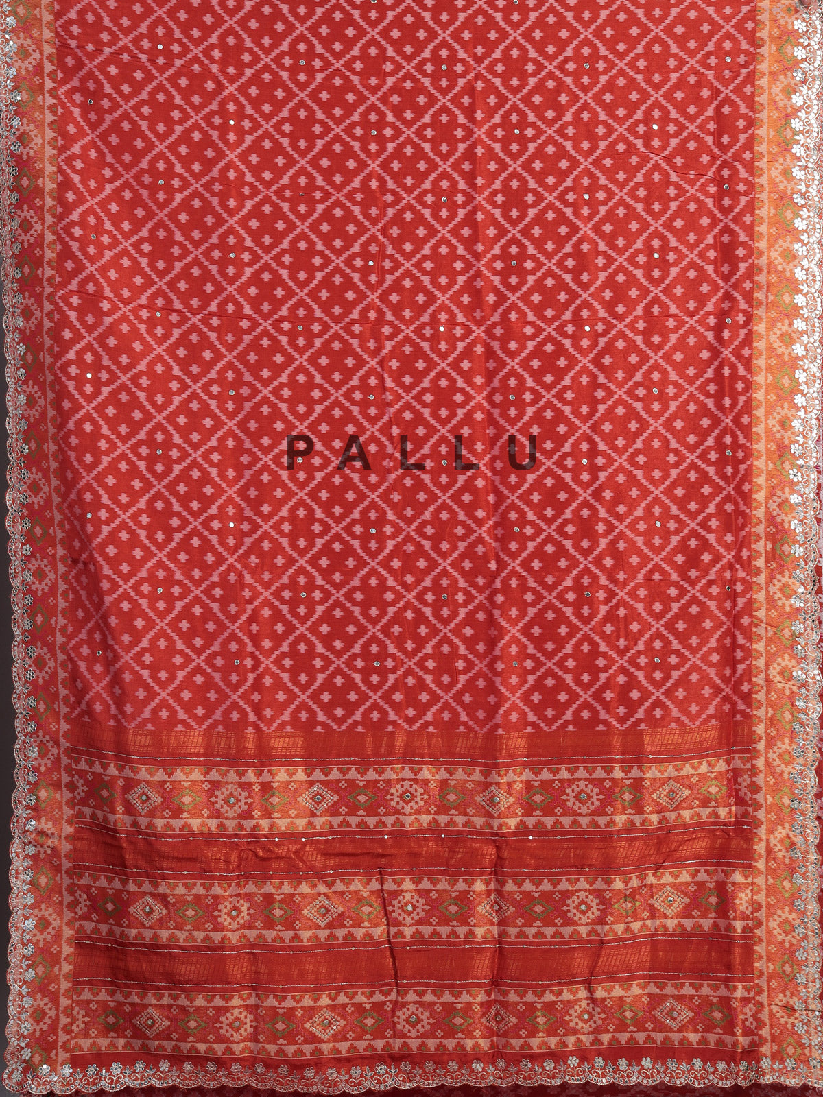 Rust orange soft silk saree with graceful ikat printed detailing