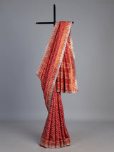 Rust orange soft silk saree with graceful ikat printed detailing