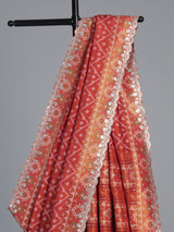 Rust orange soft silk saree with graceful ikat printed detailing