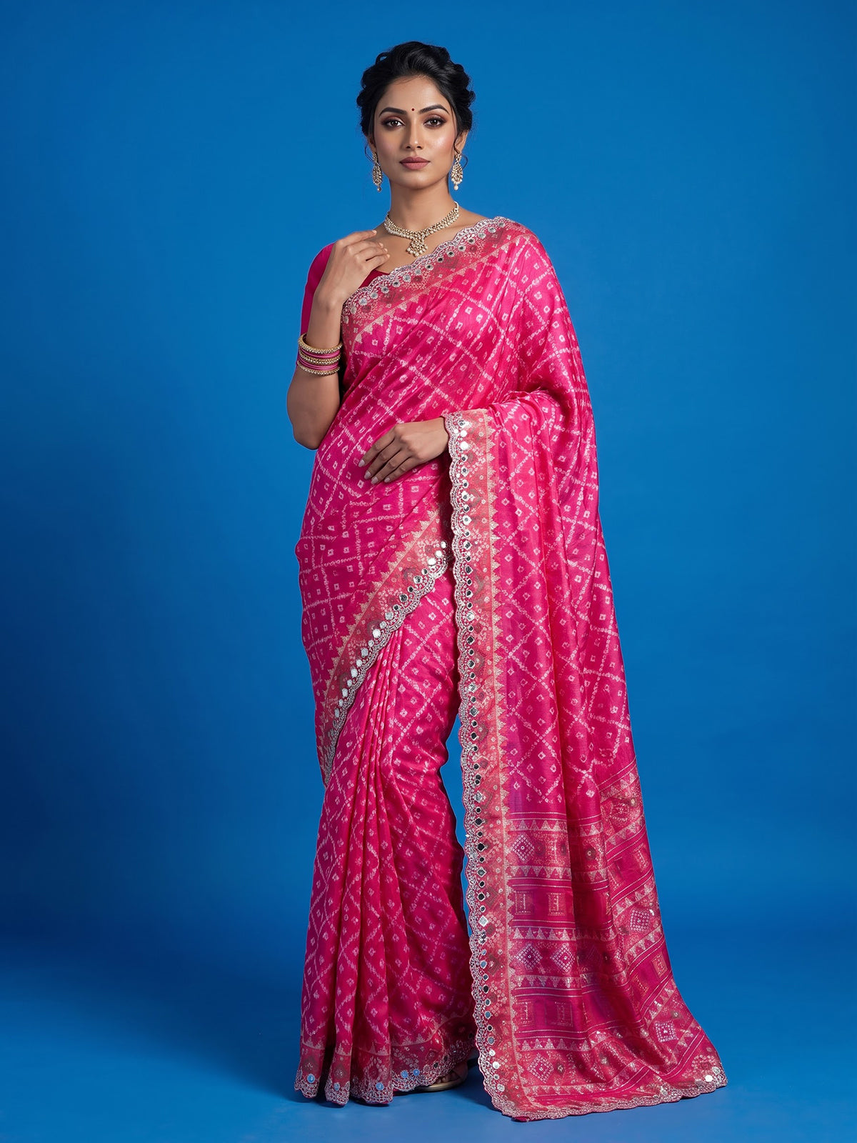 Rani pink soft silk saree with sparkling ikat printed elegance