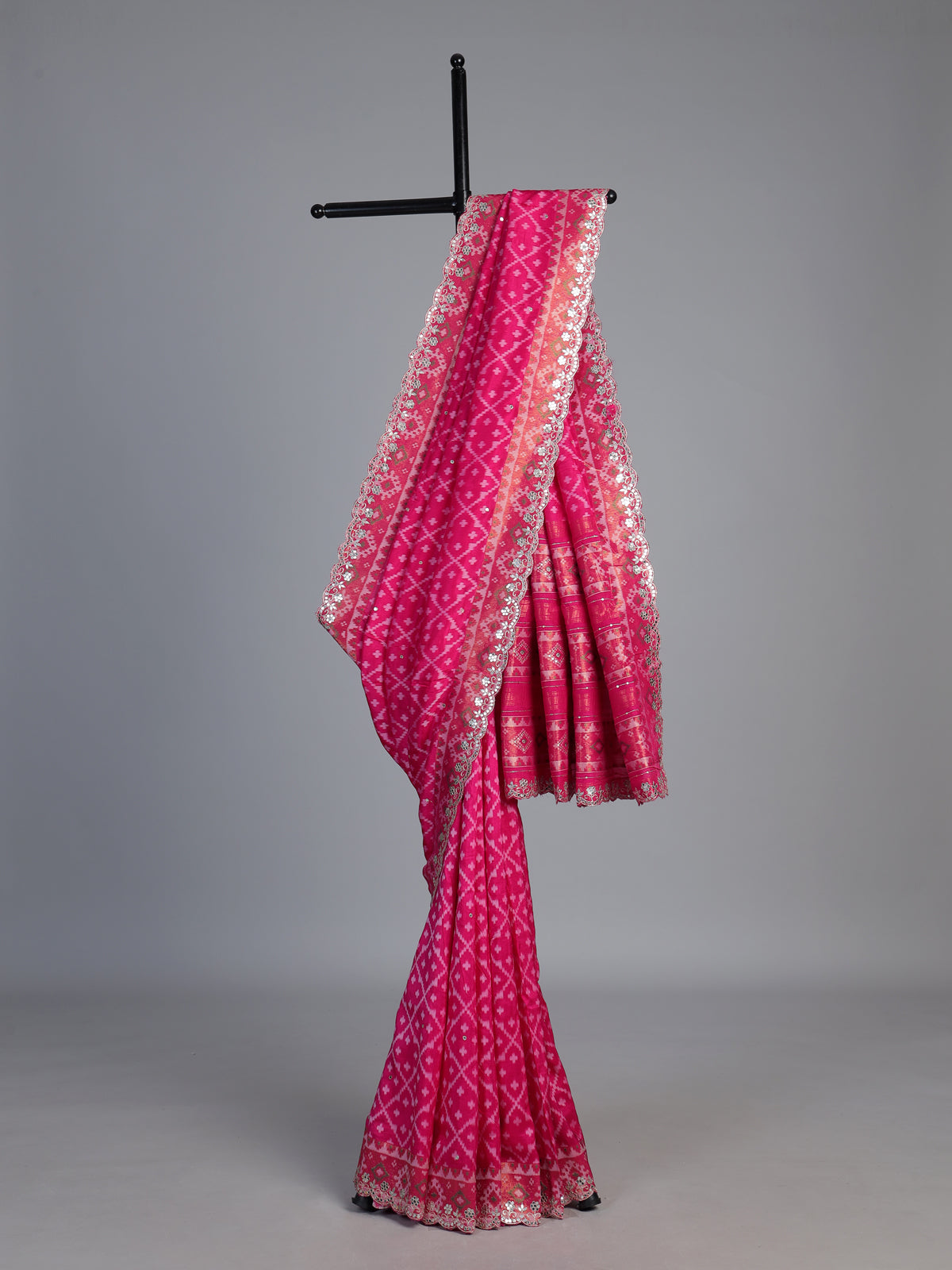 Rani pink soft silk saree with sparkling ikat printed elegance