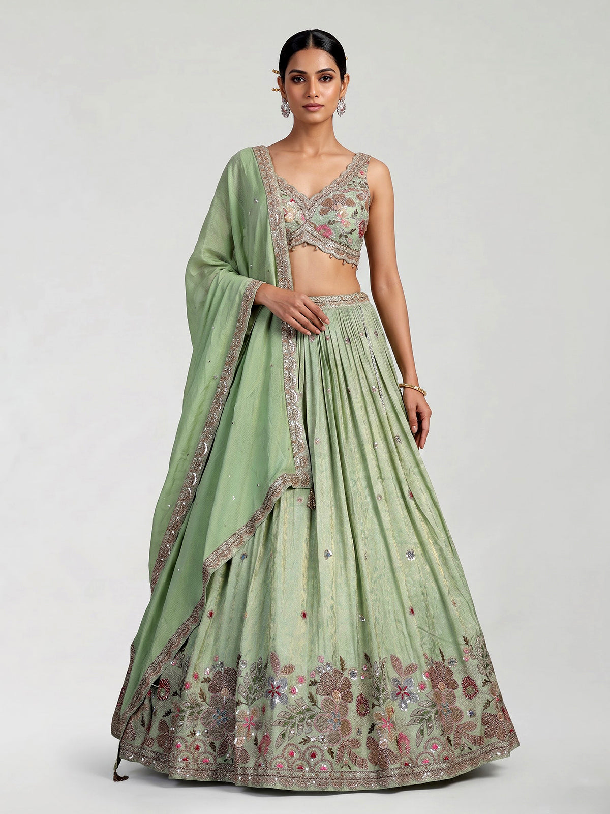 Pista green silk lehenga with zardosi festive detailing