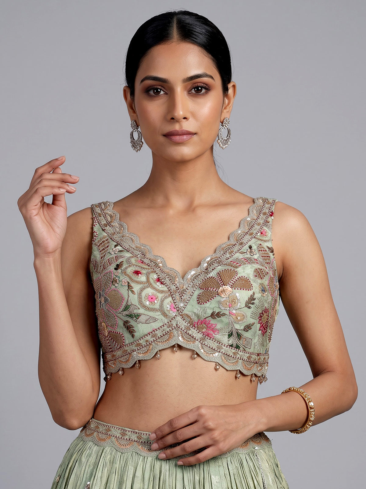 Pista green silk lehenga with zardosi festive detailing