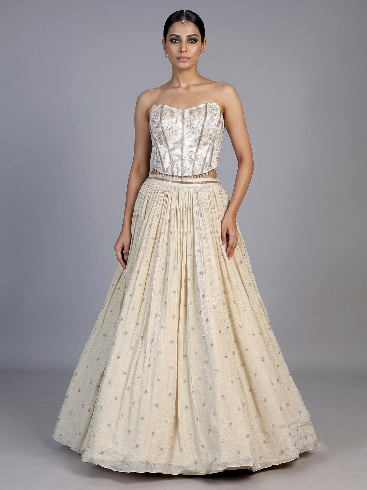 Beige chiffon silk lehenga choli with refined resham embellishments