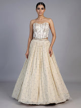 Beige chiffon silk lehenga choli with refined resham embellishments