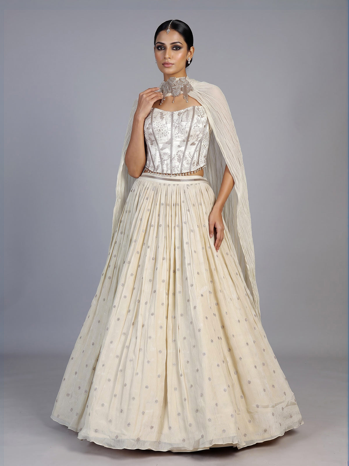 Beige chiffon silk lehenga choli with refined resham embellishments