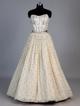 Beige chiffon silk lehenga choli with refined resham embellishments