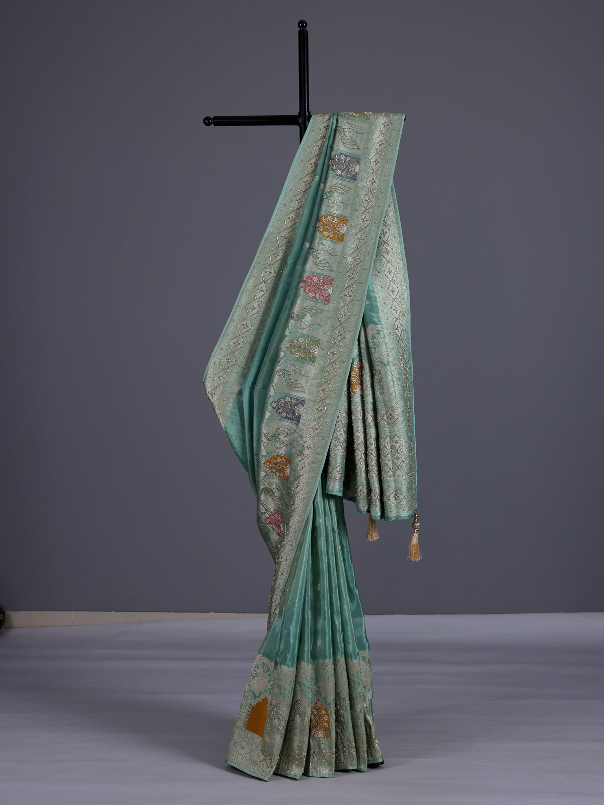 Mint blue silk saree with elegant peacock motif work