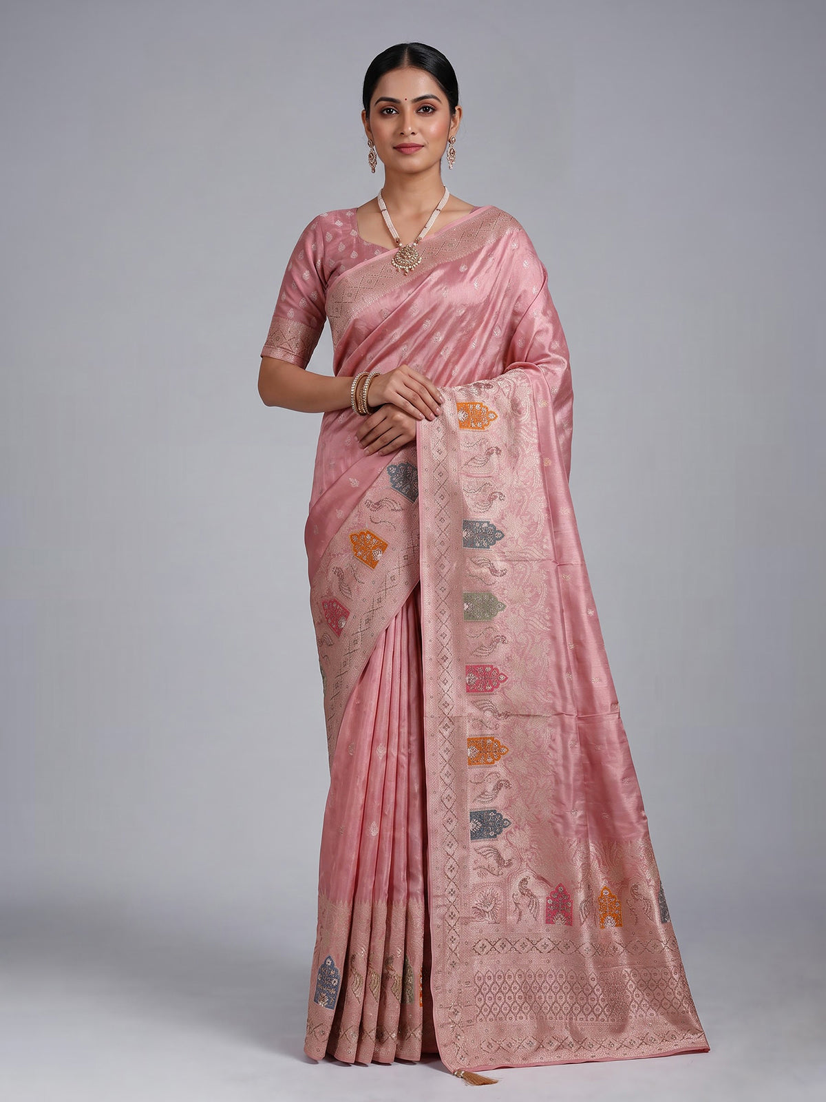 Pink silk saree with graceful peacock motif embellishments